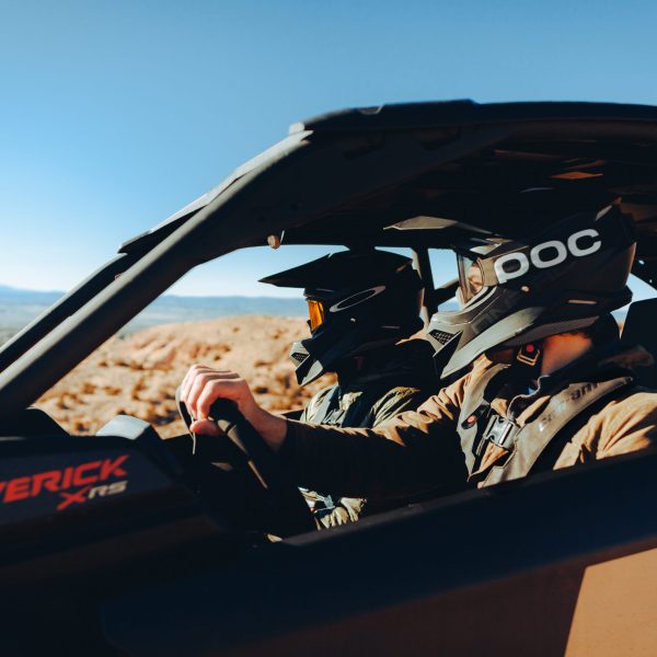 riders in a can-am side by side