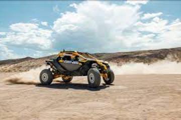 a truck driving down a dirt road