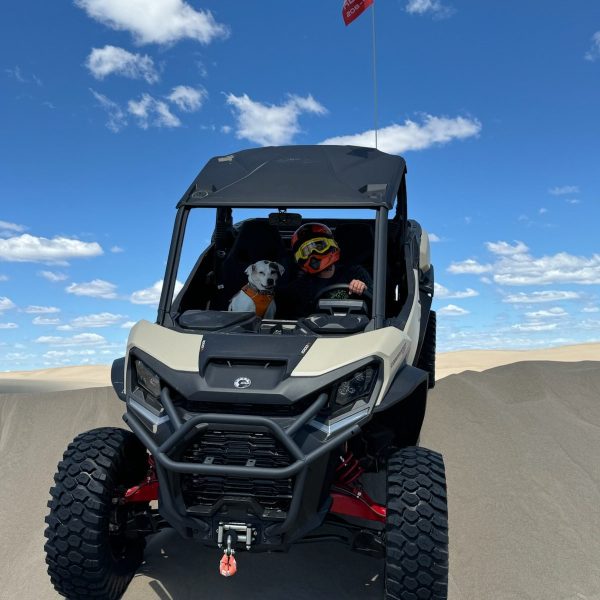 a truck that is sitting on a motorcycle