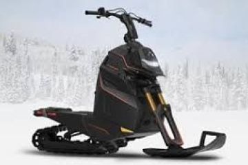 A sleek black snowmobile on a snowy landscape background.